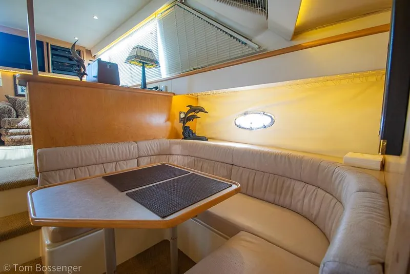Slide: The Image of Interior of 1996 Carver 370 Aft Cabin Motor Yacht with cozy dining area. - 18