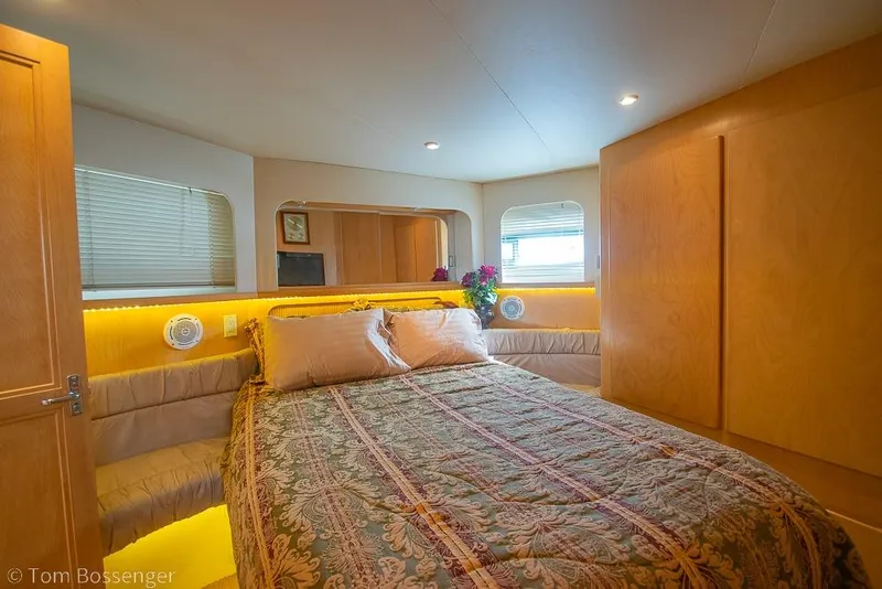 Slide: The Image of Luxurious bedroom interior of 1996 Carver 370 Aft Cabin Motor Yacht with elegant decor. - 23