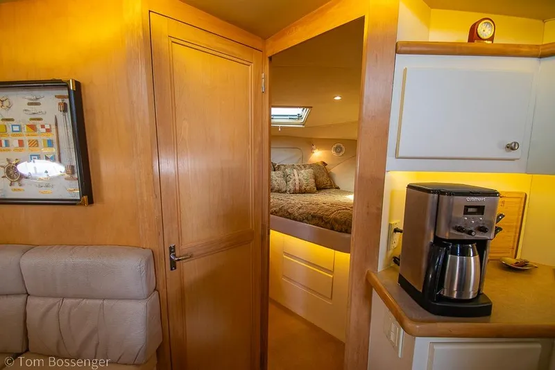Slide: The Image of Interior of 1996 Carver 370 Aft Cabin Motor Yacht with cozy bedroom and coffee maker. - 29