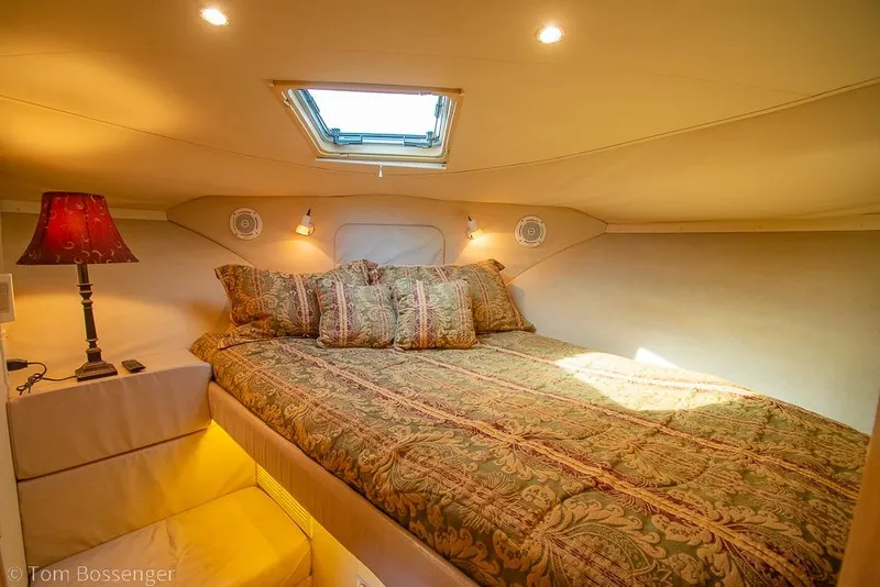 Slide: The Image of Cozy bedroom in 1996 Carver 370 Aft Cabin Motor Yacht with elegant bedding and soft lighting. - 30