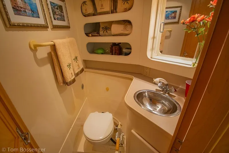 Slide: The Image of Bathroom interior of 1996 Carver 370 Aft Cabin Motor Yacht with sink and decor. - 32