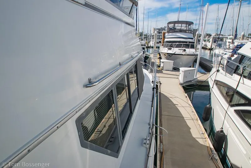 Slide: The Image of 1996 Carver 370 Aft Cabin Motor Yacht docked at marina, side view. - 42