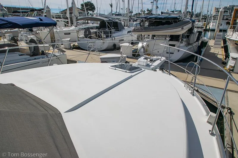 Slide: The Image of 1996 Carver 370 Aft Cabin Motor Yacht docked at marina, surrounded by other boats. - 43