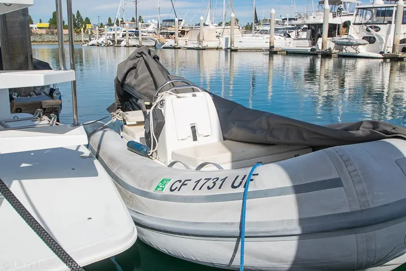 Slide: The Image of Inflatable dinghy docked beside a 1996 Carver 370 Aft Cabin Motor Yacht in a marina. - 47