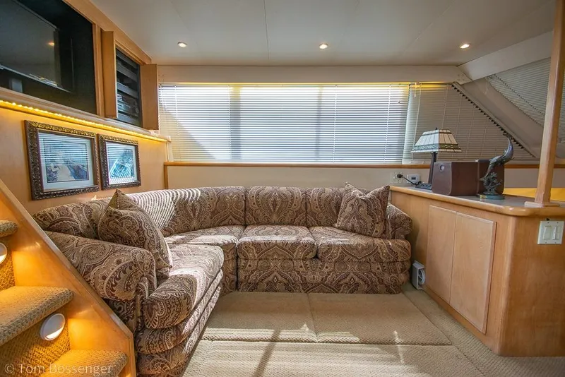 Slide: The Image of Luxurious interior of 1996 Carver 370 Aft Cabin Motor Yacht with patterned sofa and decor. - 8