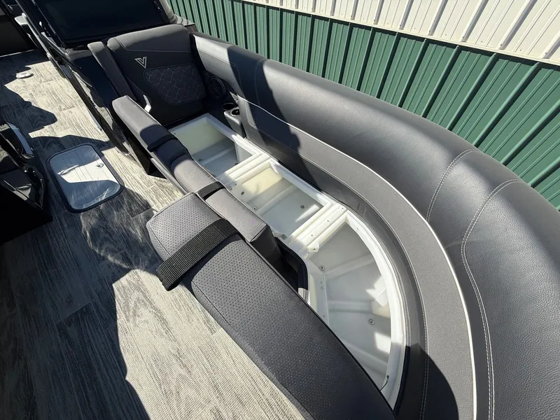 Slide: The Image of Viaggio Diamante 2024 boat with open storage and cushioned seating. - 17