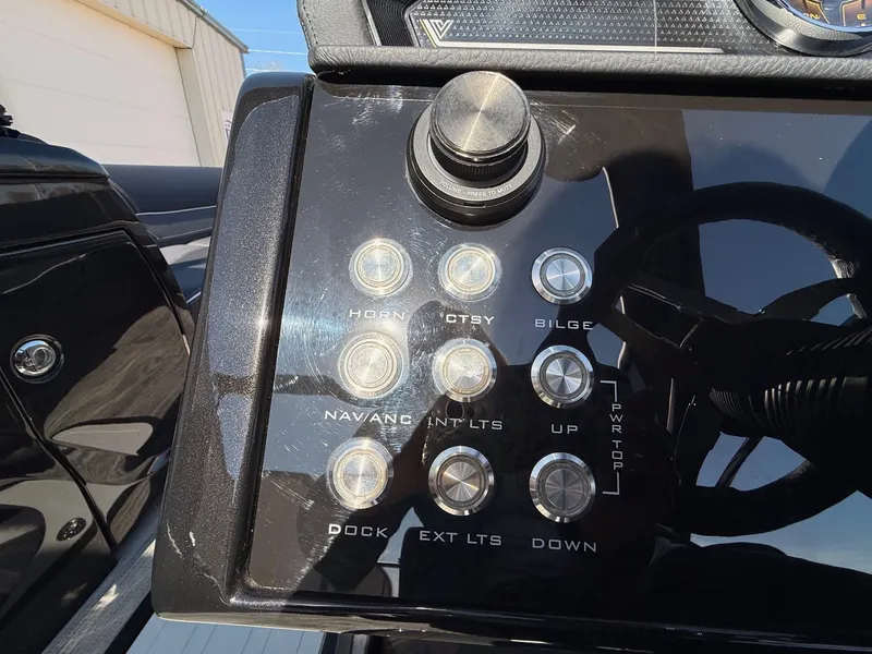 Slide: The Image of Viaggio Diamante 2024 boat console with control buttons and switches. - 23