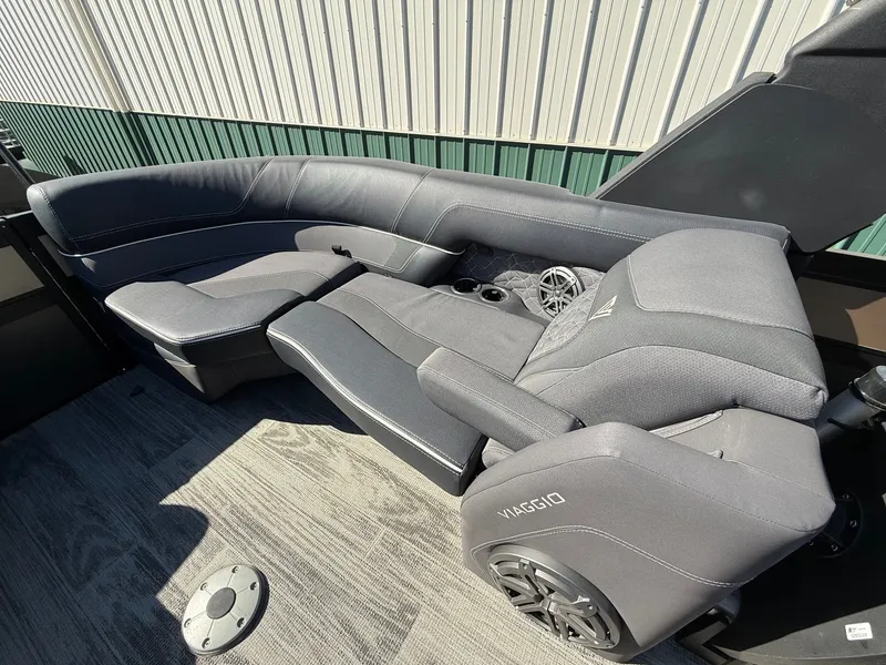 Slide: The Image of 2024 Viaggio Diamante boat seating with gray upholstery and speaker. - 30