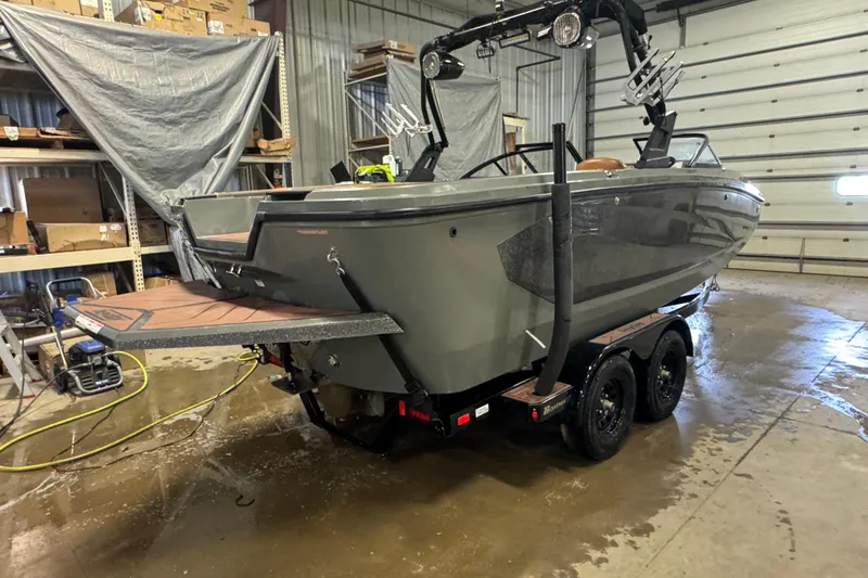 Slide: The Image of 2020 Heyday WT-2DC boat on trailer in a garage setting. - 2