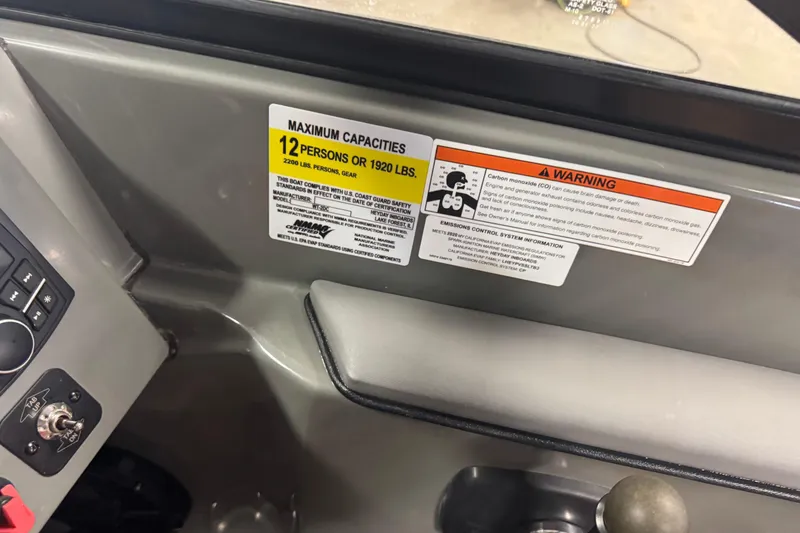 Slide: The Image of Control panel of 2020 Heyday WT-2DC boat with capacity and safety warnings. - 7