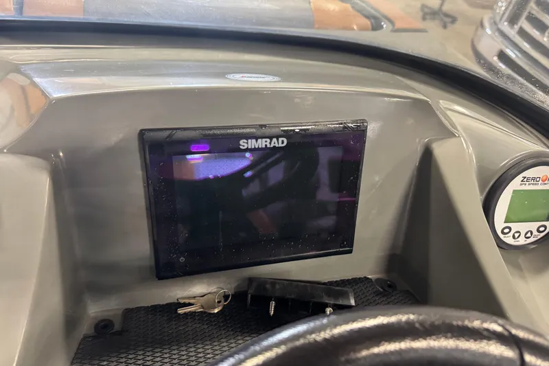 Slide: The Image of Dashboard of a 2020 Heyday WT-2DC boat featuring a Simrad display and GPS speed control. - 8