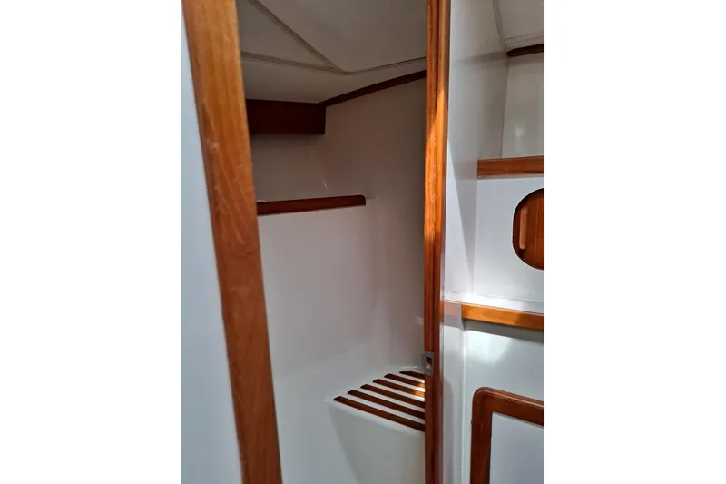 Slide: The Image of Interior of 1998 Caliber 40LRC sailboat with wooden trim and white walls. - 14