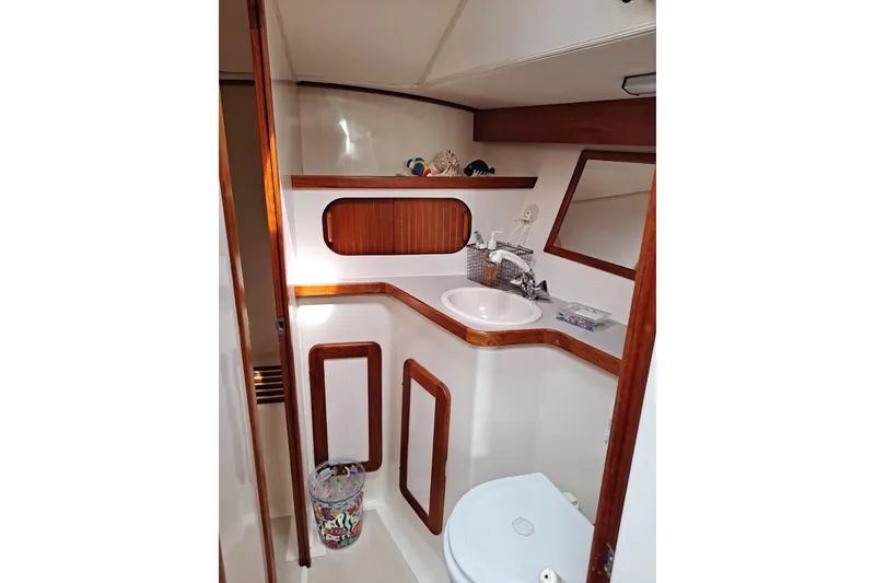 Slide: The Image of 1998 Caliber 40LRC yacht bathroom with wooden accents and modern fixtures. - 15