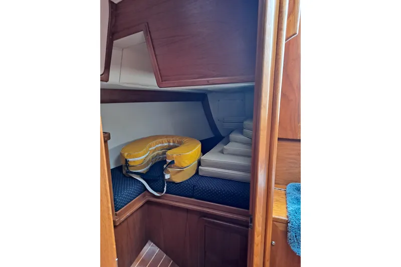 Slide: The Image of 1998 Caliber 40LRC yacht interior with life preserver and cushions in cabin. - 17