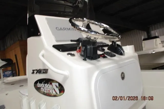 Slide: The Image of 2025 Skeeter SX241 boat console with Garmin navigation system, photographed indoors. - 5