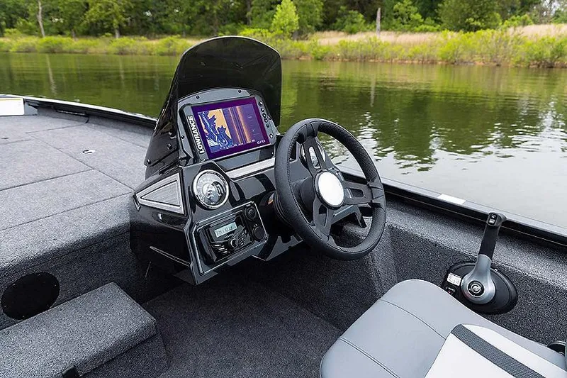 Slide: The Image of Manufacturer Provided Image: 2025 Lowe Stinger 195C boat interior with steering wheel and navigation system. - 4