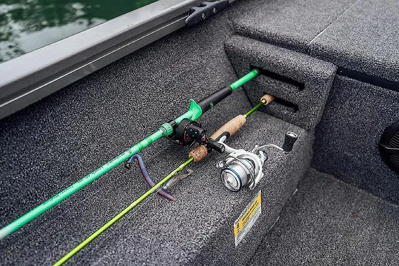 Slide: The Image of Manufacturer Provided Image: Fishing rods on 2025 Lowe Stinger 195C boat deck, showcasing storage features. - 5