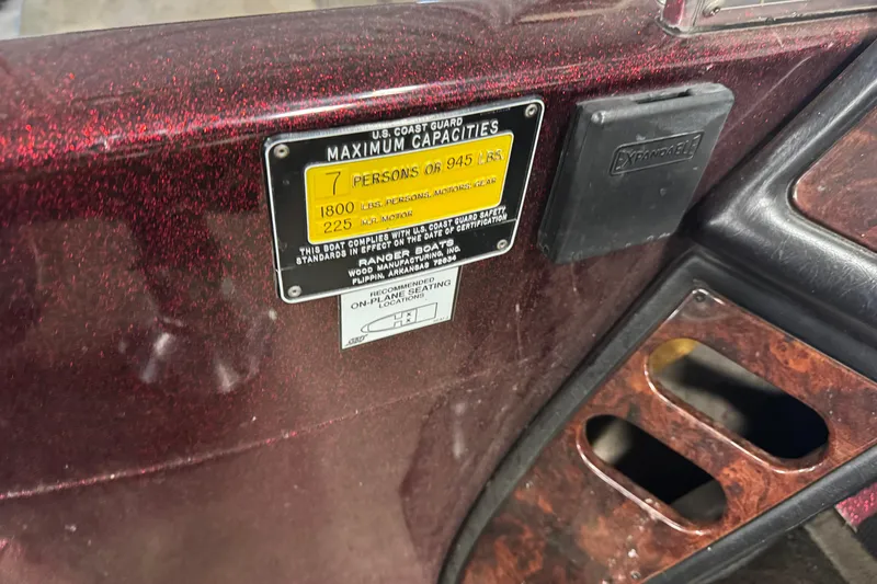 Slide: The Image of 2000 Ranger 620VS Fisherman boat capacity label, showing limits for persons, weight, and motor. - 10