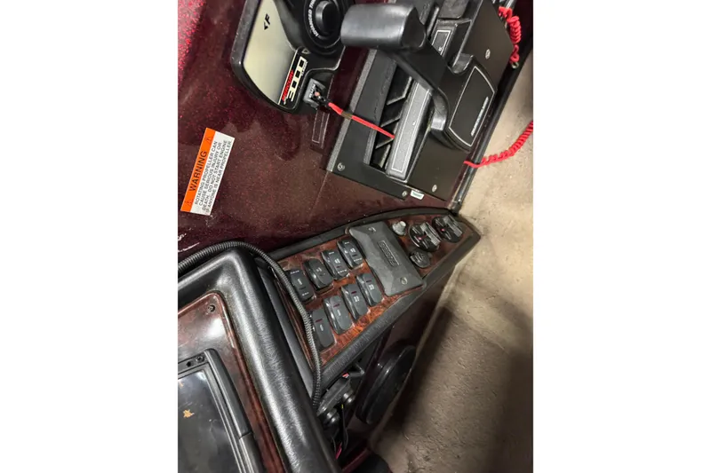Slide: The Image of Control panel of a 2000 Ranger 620VS Fisherman boat with switches and throttle. - 13
