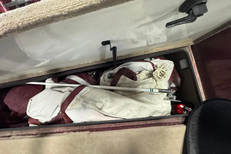 Slide: The Image of Storage compartment in a 2000 Ranger 620VS Fisherman boat with gear and equipment. - 19
