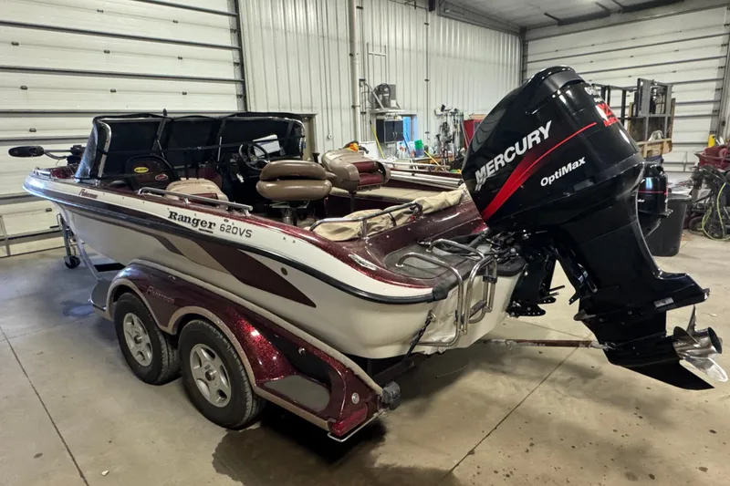 Slide: The Image of 2000 Ranger 620VS Fisherman boat with Mercury OptiMax engine in a garage. - 4