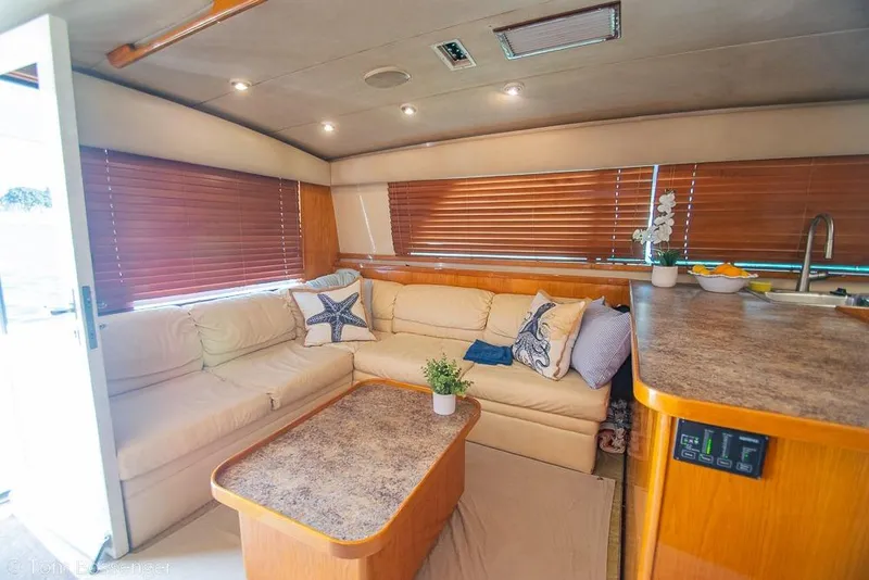 Slide: The Image of Luxurious interior of 1989 Bertram 50 Convertible yacht with cozy seating and elegant decor. - 14