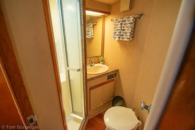 Slide: The Image of Bathroom interior of 1989 Bertram 50 Convertible yacht with shower and sink. - 28