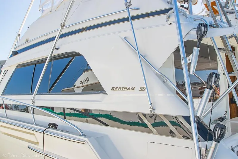 Slide: The Image of 1989 Bertram 50 Convertible yacht with sleek design and chrome accents. - 3