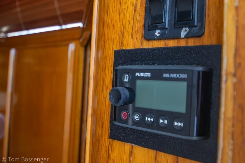 Slide: The Image of Fusion MS-NRX300 stereo system on 1989 Bertram 50 Convertible yacht's wooden interior. - 31