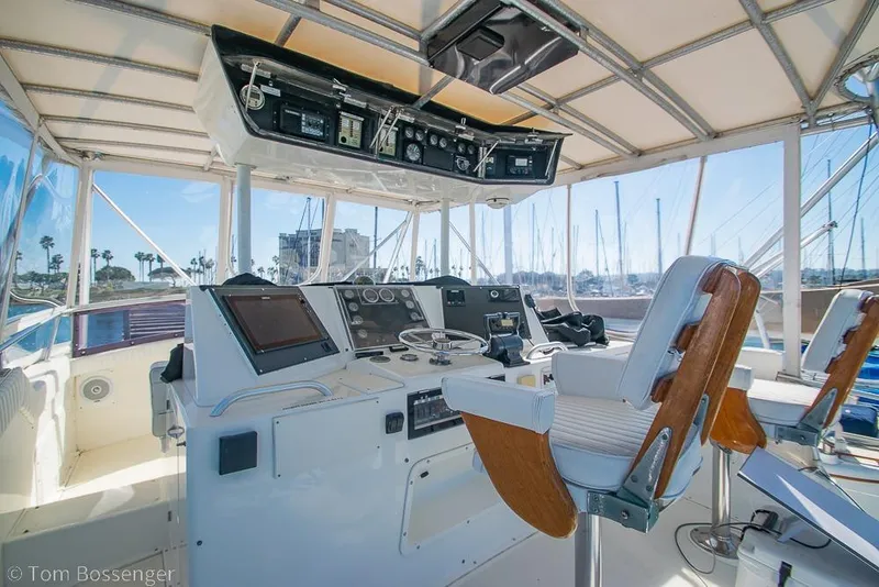 Slide: The Image of Cockpit of 1989 Bertram 50 Convertible yacht with navigation equipment and captain's chair. - 38