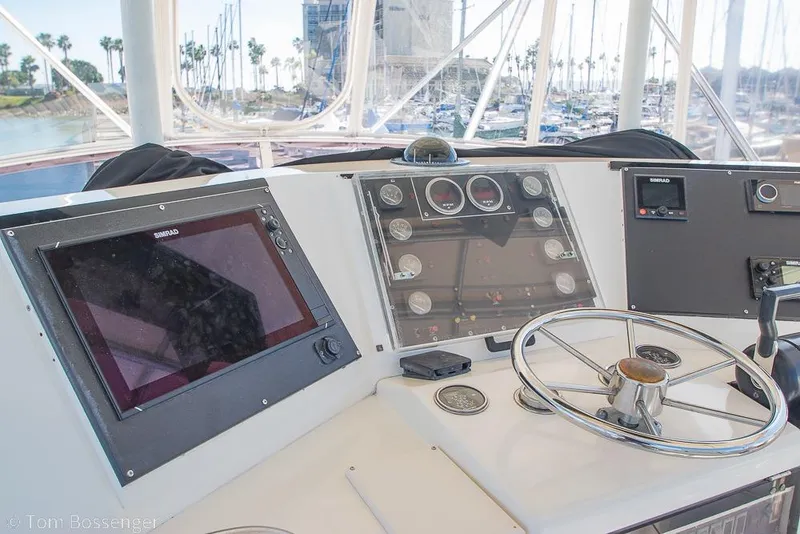 Slide: The Image of Helm of 1989 Bertram 50 Convertible with navigation equipment and steering wheel. - 40