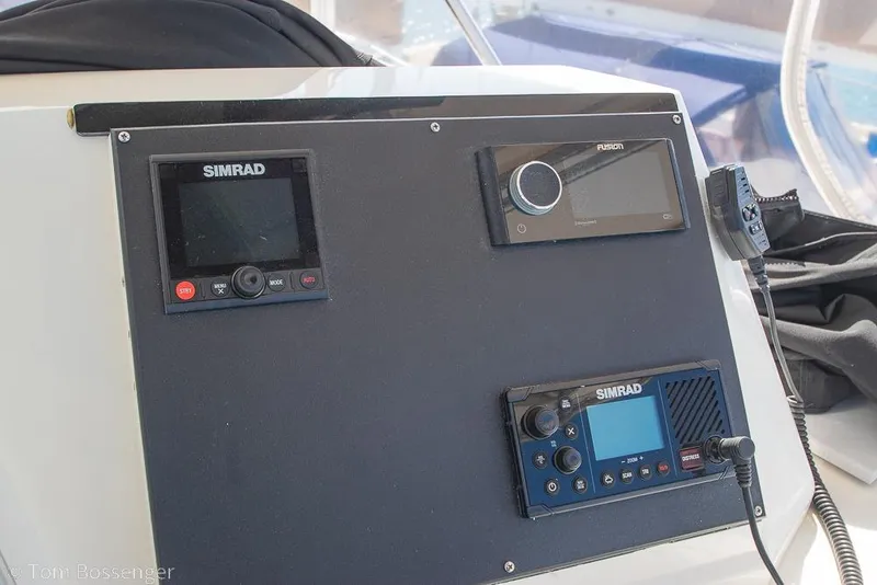Slide: The Image of Control panel of a 1989 Bertram 50 Convertible with Simrad and Fusion electronics. - 41