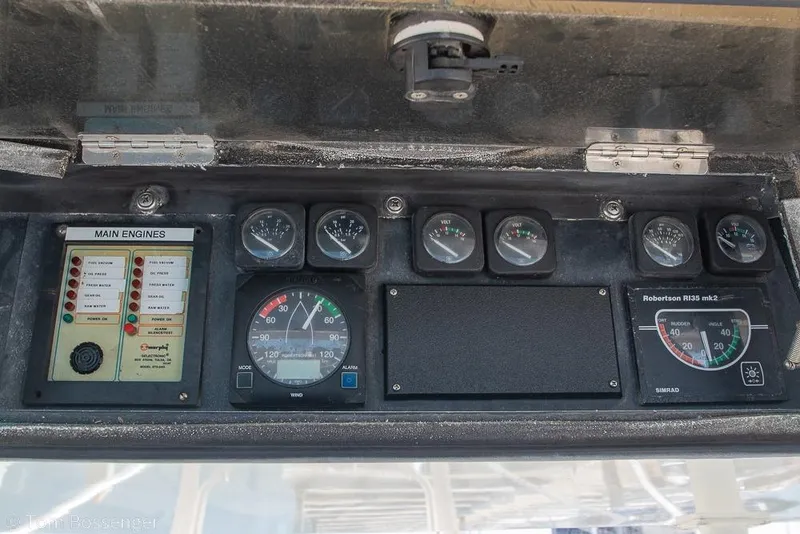 Slide: The Image of Control panel of a 1989 Bertram 50 Convertible boat with various gauges and indicators. - 45