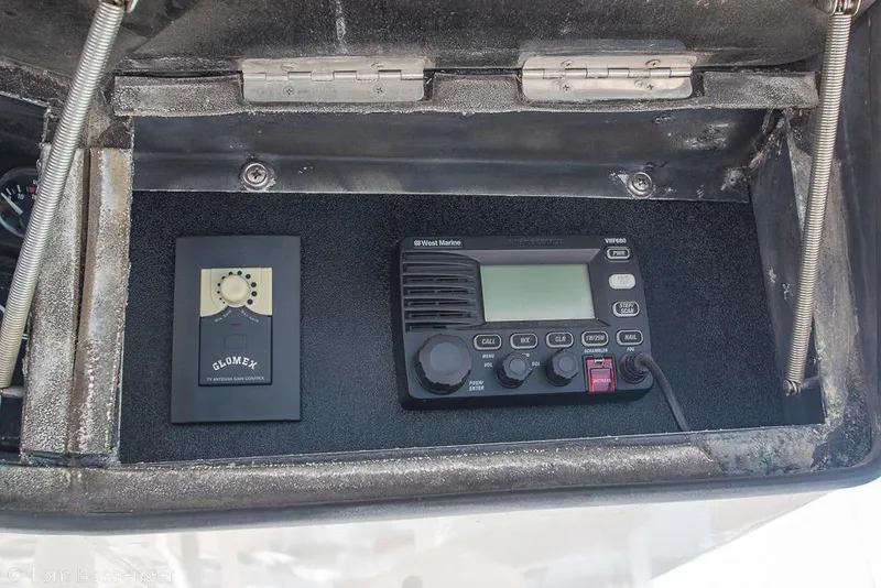 Slide: The Image of Control panel of a 1989 Bertram 50 Convertible with radio and Glomex antenna control. - 46