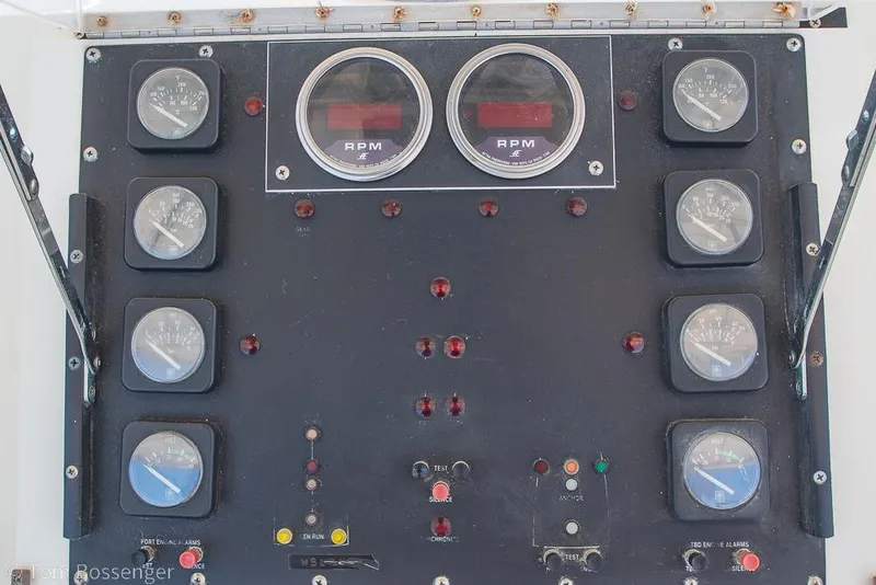 Slide: The Image of Control panel of a 1989 Bertram 50 Convertible boat with gauges and RPM meters. - 47