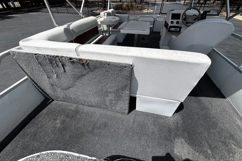Slide: The Image of 2001 Godfrey Sweetwater 20 pontoon boat interior with seating and steering console. - 13