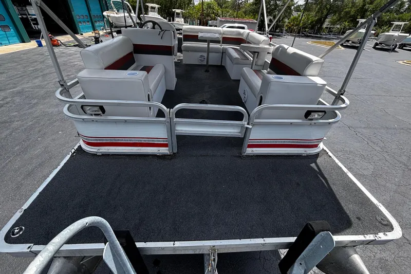 Slide: The Image of 2001 Godfrey Sweetwater 20 pontoon boat with spacious seating and open deck layout. - 3