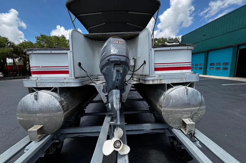 Slide: The Image of 2001 Godfrey Sweetwater 20 pontoon boat with Yamaha outboard motor on trailer. - 4
