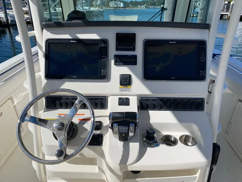 Slide: The Image of 2014 Boston Whaler 320 Outrage helm with electronics. - 4