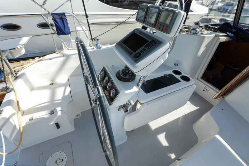 Slide: The Image of Cockpit of a 2010 Catalina 375 sailboat with navigation instruments and steering wheel. - 10