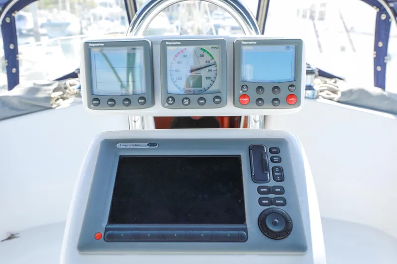 Slide: The Image of Cockpit navigation instruments on a 2010 Catalina 375 sailboat. - 13