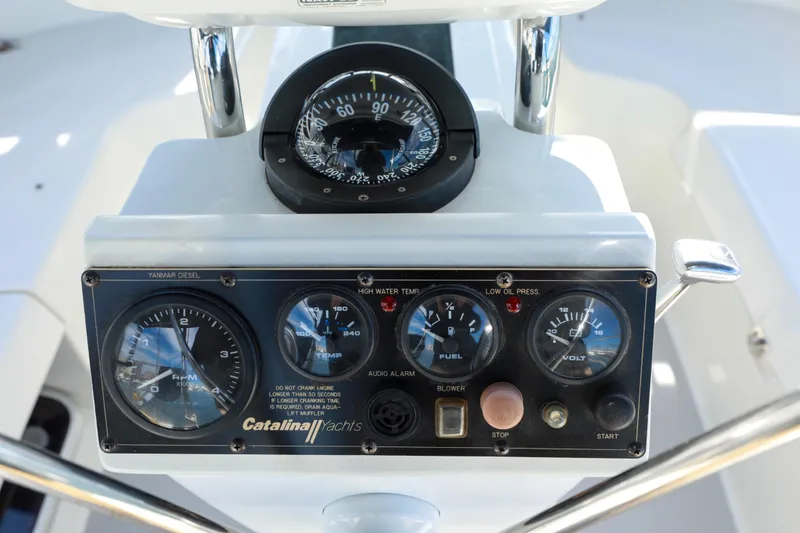Slide: The Image of Control panel of a 2010 Catalina 375 yacht with gauges and compass. - 20