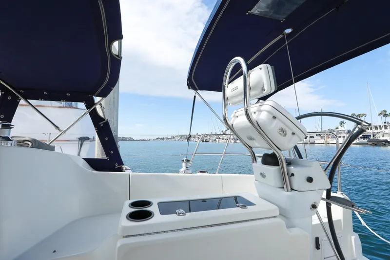 Slide: The Image of Cockpit view of 2010 Catalina 375 sailboat with marina backdrop. - 26
