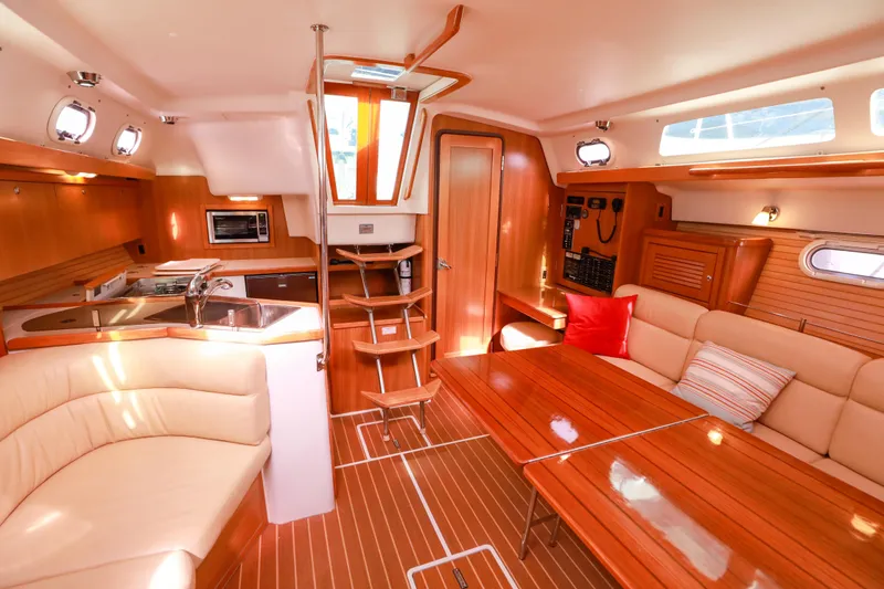 Slide: The Image of Luxurious interior of a 2010 Catalina 375 sailboat with wood finishes and cozy seating. - 28