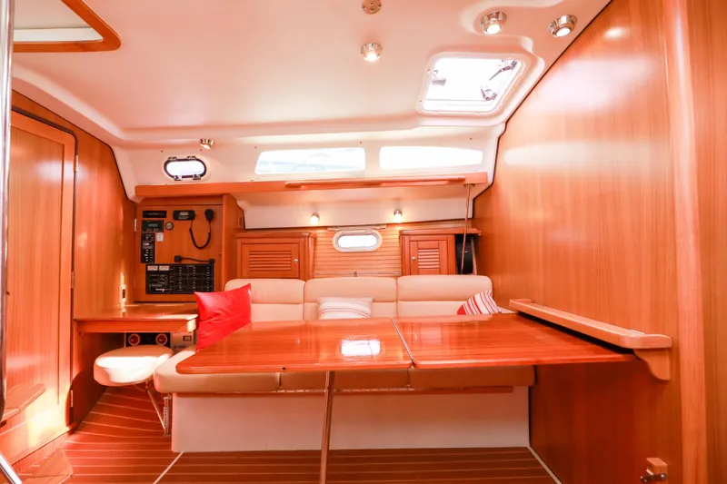 Slide: The Image of Interior of 2010 Catalina 375 sailboat with wooden finish and cozy seating area. - 29