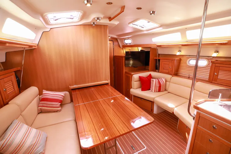 Slide: The Image of Luxurious interior of 2010 Catalina 375 sailboat with wood finish and cozy seating. - 32