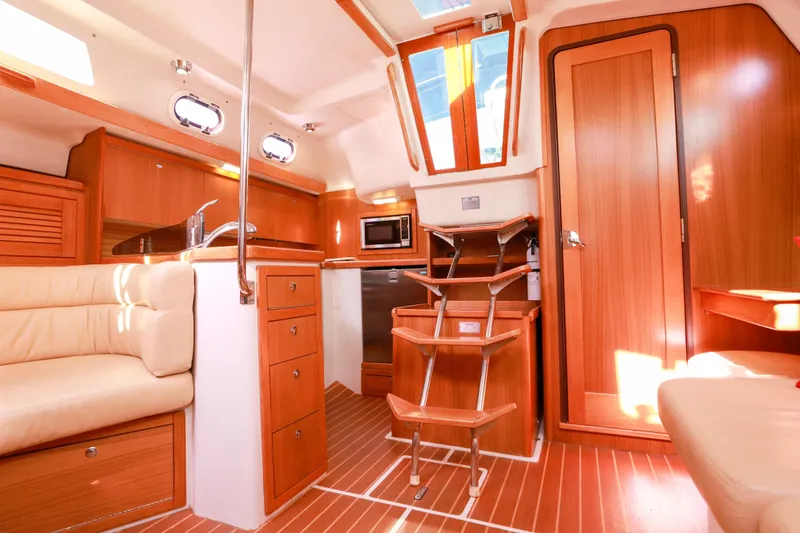 Slide: The Image of Interior of 2010 Catalina 375 sailboat with wooden cabinetry and modern amenities. - 33