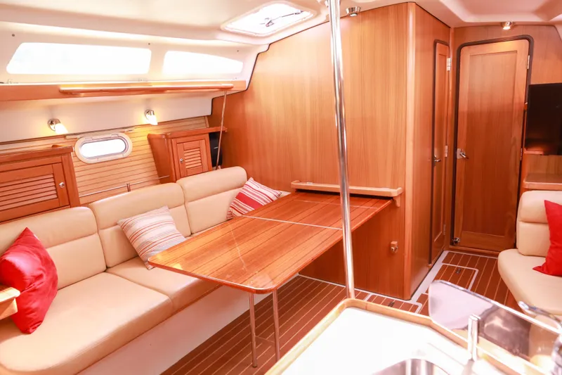 Slide: The Image of Interior of 2010 Catalina 375 sailboat with cozy seating and wooden finishes. - 34