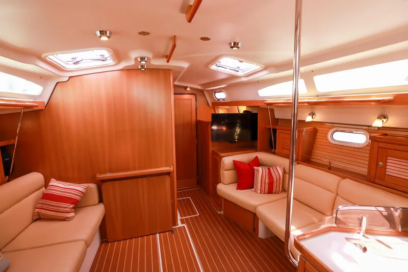 Slide: The Image of Interior of 2010 Catalina 375 sailboat with cozy seating and modern wood finish. - 36