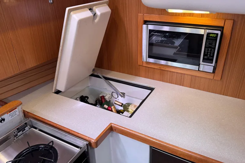 Slide: The Image of Galley of 2010 Catalina 375 yacht with microwave and built-in storage. - 41